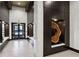 Modern hallway with decorative wood art piece and built-in seating at 855 Peachtree Ne St # 3005, Atlanta, GA 30308
