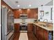 Well-appointed kitchen features stainless steel appliances, granite countertops, and custom cabinetry at 855 Peachtree Ne St # 3005, Atlanta, GA 30308