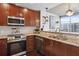 Contemporary kitchen with stainless steel appliances, granite countertops, and modern pendant lighting at 855 Peachtree Ne St # 3005, Atlanta, GA 30308