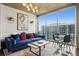 Cozy living room with decor and furniture, and large windows offering city views at 855 Peachtree Ne St # 3005, Atlanta, GA 30308