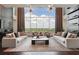 Bright living room with large windows and comfortable seating at 855 Peachtree Ne St # 3005, Atlanta, GA 30308