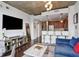 Open-concept living room with modern furnishings, adjacent kitchen, and hardwood floors offers a comfortable space at 855 Peachtree Ne St # 3005, Atlanta, GA 30308