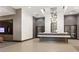 A bright lobby featuring a modern chandelier and a reception desk at 855 Peachtree Ne St # 3005, Atlanta, GA 30308