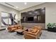 Lounge area features leather chairs, modern decor, and statement artwork at 855 Peachtree Ne St # 3005, Atlanta, GA 30308