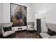 Cozy seating area with stylish chairs, floor lamp, and decorative artwork at 855 Peachtree Ne St # 3005, Atlanta, GA 30308
