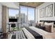 Sun-filled main bedroom has a city view, a desk, and is tastefully decorated at 855 Peachtree Ne St # 3005, Atlanta, GA 30308