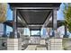 Outdoor kitchen with stainless steel grill and granite countertops at 855 Peachtree Ne St # 3005, Atlanta, GA 30308