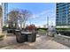 Outdoor patio area with tables, chairs, and landscaping at 855 Peachtree Ne St # 3005, Atlanta, GA 30308