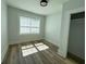 Bright bedroom featuring natural light, hardwood floors, and a closet at 880 Westmont Sw Rd, Atlanta, GA 30311