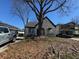 Charming brick home featuring arched porch, landscaped yard, and mature shade tree at 880 Westmont Sw Rd, Atlanta, GA 30311