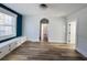 Spacious living room featuring hardwood floors, built-in cabinets, and modern window trim at 880 Westmont Sw Rd, Atlanta, GA 30311