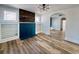 Living room with hardwood floors, built-in shelves, and an decorative fireplace at 880 Westmont Sw Rd, Atlanta, GA 30311