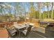 Inviting back deck with outdoor dining, featuring a grill and hot tub, perfect for relaxing and entertaining guests at 3638 Clubside Nw Walk, Kennesaw, GA 30144