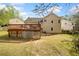View of backyard featuring a wooden deck, ideal for outdoor gatherings or peaceful relaxation at 3638 Clubside Nw Walk, Kennesaw, GA 30144