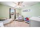 Serene, carpeted Bedroom with gray accent chair, a window with view, and a playful collection of -friendly decor at 3638 Clubside Nw Walk, Kennesaw, GA 30144