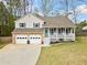 Charming two-story home with a welcoming front porch, stone accents, and a well-manicured lawn at 3638 Clubside Nw Walk, Kennesaw, GA 30144