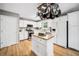 Spacious kitchen with white cabinets, stainless steel appliances, and wood floors at 3638 Clubside Nw Walk, Kennesaw, GA 30144
