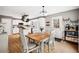 Open kitchen and dining area featuring stainless steel appliances, white cabinets, and stylish decor at 3638 Clubside Nw Walk, Kennesaw, GA 30144