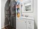 Modern laundry room with stacked washer and dryer unit and white vanity at 3638 Clubside Nw Walk, Kennesaw, GA 30144