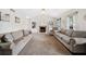 Spacious living room with vaulted ceiling, fireplace, lots of natural light, neutral carpet and paint at 3638 Clubside Nw Walk, Kennesaw, GA 30144