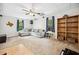 Large living room with projector, ceiling fan, built-in shelves, and comfortable seating at 3638 Clubside Nw Walk, Kennesaw, GA 30144