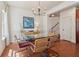 Charming dining room showcasing a glass table and view of the staircase at 5890 Vinyard Ln, Cumming, GA 30041