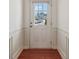 Bright entryway with hardwood floors and a white door with glass inserts at 5890 Vinyard Ln, Cumming, GA 30041
