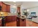 Cozy kitchen featuring an island and seamlessly flowing into the living space at 5890 Vinyard Ln, Cumming, GA 30041