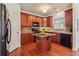 Cozy kitchen with warm wood cabinets, granite countertops, and stainless appliances at 5890 Vinyard Ln, Cumming, GA 30041
