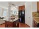 Stylish kitchen island featuring granite countertops and warm wood cabinetry at 5890 Vinyard Ln, Cumming, GA 30041