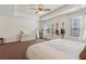 Spacious main bedroom with lots of light featuring neutral colors and unique guitar display at 5890 Vinyard Ln, Cumming, GA 30041