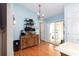 Dining Area with a sliding door to the outside, a wooden dresser and hard wood floors at 603 Bluff Dr, Woodstock, GA 30188