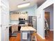 Bright kitchen featuring stainless steel appliances, a wooden island, and a light blue color scheme at 603 Bluff Dr, Woodstock, GA 30188