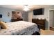 Bedroom with ample natural light, coastal decor, a dark wood bed, ceiling fan, and dressers at 603 Bluff Dr, Woodstock, GA 30188