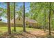The back of the house, showing a large yard and wooded area at 270 Albertas Ct, Mcdonough, GA 30252