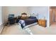A bedroom features carpeted floors, a desk, and a window at 270 Albertas Ct, Mcdonough, GA 30252