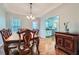Elegant dining room with hardwood floors, a decorative chandelier, and a formal dining set at 270 Albertas Ct, Mcdonough, GA 30252