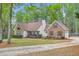 Charming two-story home with brick accents, a well-manicured lawn, and mature trees at 270 Albertas Ct, Mcdonough, GA 30252