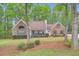 Lovely two-story home with lush landscaping, mature trees, and a brick facade at 270 Albertas Ct, Mcdonough, GA 30252