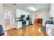 A kitchen showcases stainless steel appliances, black countertops, and white cabinetry at 270 Albertas Ct, Mcdonough, GA 30252
