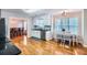 A well-lit kitchen boasts stainless appliances, white cabinets, and hardwood floors at 270 Albertas Ct, Mcdonough, GA 30252
