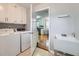 Bright laundry room featuring modern appliances, ample counter space, and a utility sink at 270 Albertas Ct, Mcdonough, GA 30252