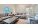 Comfortable living room featuring plush couches, a coffee table, and a window with natural light at 270 Albertas Ct, Mcdonough, GA 30252