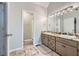 A well-lit main bathroom features a dual sink vanity and separate shower at 270 Albertas Ct, Mcdonough, GA 30252