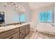 A spacious main bathroom features double sinks, a soaking tub, and tile floors at 270 Albertas Ct, Mcdonough, GA 30252