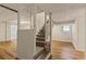 Basement staircase with white railings and wood-look floors at 3501 Wesley Chapel Rd, Decatur, GA 30034