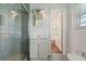 Updated bathroom featuring a tiled shower, vanity, and modern fixtures at 3501 Wesley Chapel Rd, Decatur, GA 30034