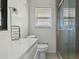 Bright bathroom showcasing a toilet, vanity and glass enclosed shower at 3501 Wesley Chapel Rd, Decatur, GA 30034