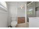 Bathroom with toilet, updated shower, and single sink at 3501 Wesley Chapel Rd, Decatur, GA 30034