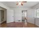 Spacious bedroom featuring wood floors, windows, and two closets at 3501 Wesley Chapel Rd, Decatur, GA 30034